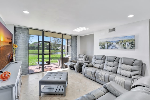 tiled living room with expansive windows