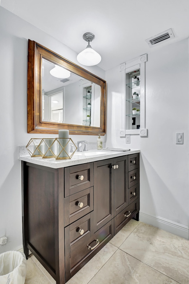 bathroom with vanity, tasteful backsplash, and tile patterned floors