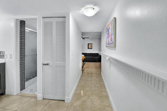 hallway featuring light tile patterned flooring