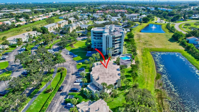 birds eye view of property featuring a water view