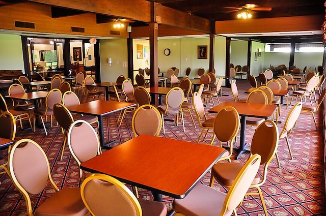 dining room featuring carpet flooring, ceiling fan, and beam ceiling