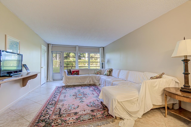 tiled living room with a textured ceiling