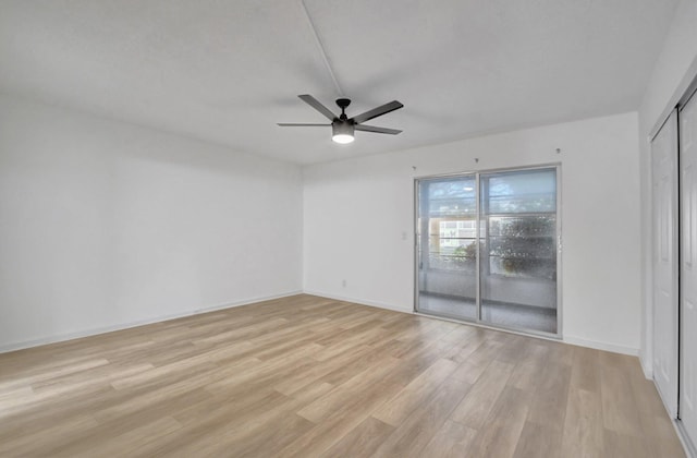 unfurnished room with ceiling fan and light wood-type flooring