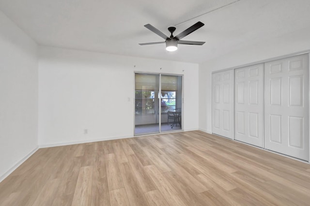 unfurnished bedroom with access to exterior, ceiling fan, and light wood-type flooring