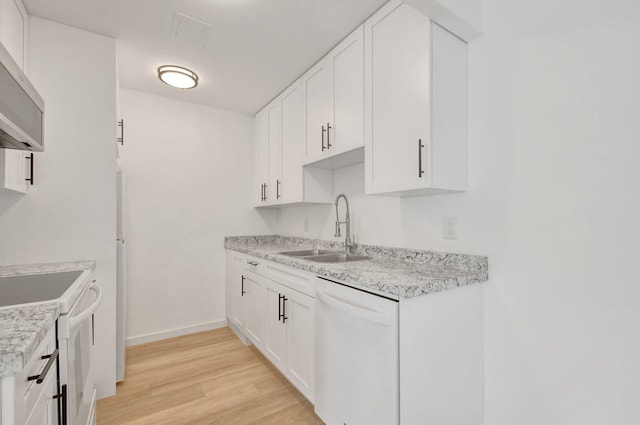 kitchen featuring white cabinets, light hardwood / wood-style floors, white appliances, and sink