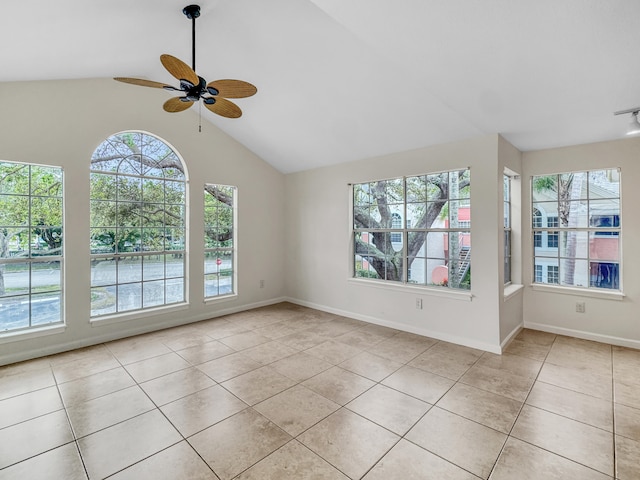 tiled spare room with ceiling fan and lofted ceiling