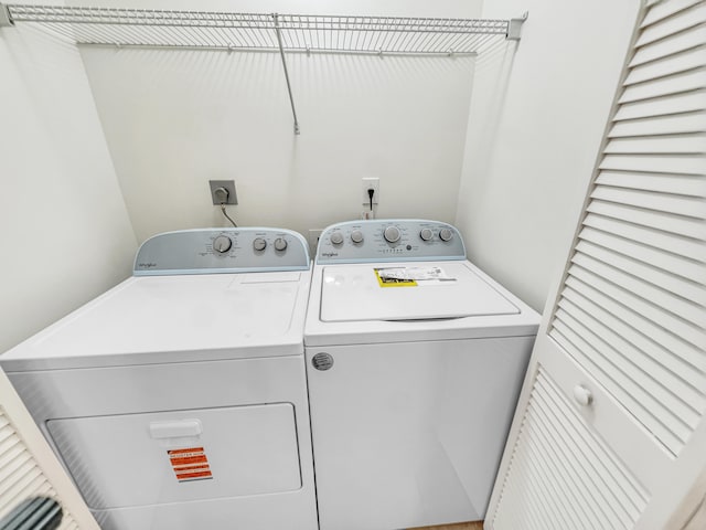 laundry room featuring separate washer and dryer