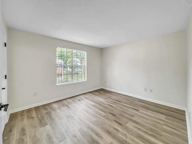 unfurnished room with light hardwood / wood-style flooring