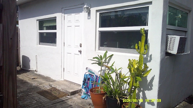 doorway to property with cooling unit