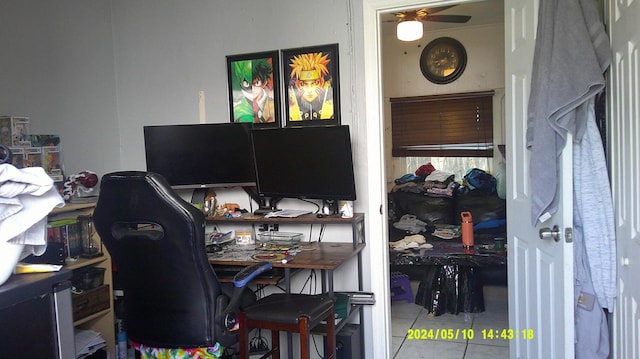 tiled office space featuring ceiling fan