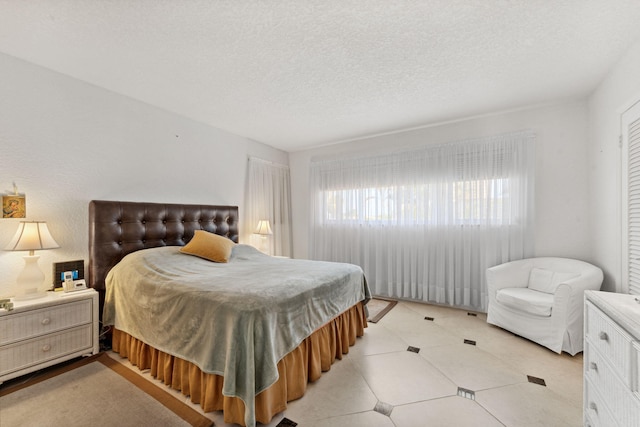 bedroom featuring a textured ceiling