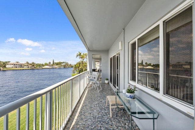 balcony featuring a water view