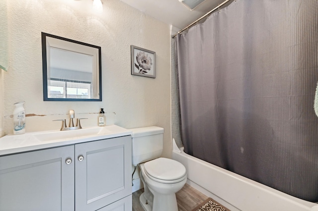 full bathroom featuring vanity, toilet, and shower / tub combo with curtain