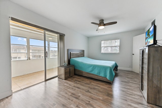 bedroom with ceiling fan and light hardwood / wood-style floors