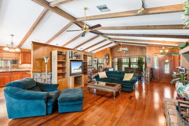 5405 Duckweed Rd, Wellington, FL 33449 - living room with lofted ceiling with beams, wood-type flooring, and ceiling fan with notable chandelier