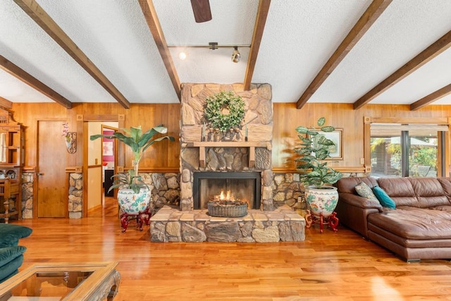 5405 Duckweed Rd, Wellington, FL 33449 - living room featuring a fireplace, lofted ceiling with beams, and hardwood / wood-style flooring