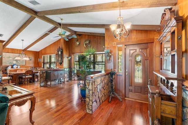 5405 Duckweed Rd, Wellington, FL 33449 - entryway with hardwood / wood-style floors, ceiling fan with notable chandelier, wood walls, and beam ceiling