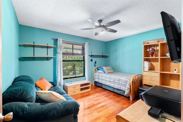 5405 Duckweed Rd, Wellington, FL 33449 - bedroom featuring ceiling fan, wood-type flooring, and a textured ceiling