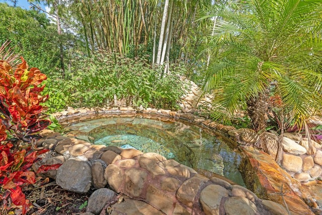 5405 Duckweed Rd, Wellington, FL 33449 - exterior details with a garden pond