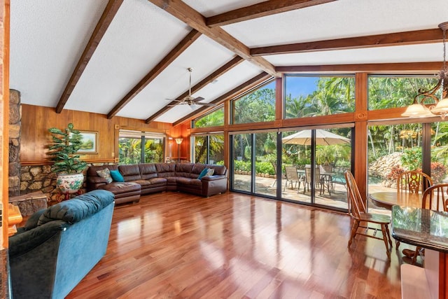 5405 Duckweed Rd, Wellington, FL 33449 - living room with hardwood / wood-style floors, lofted ceiling with beams, ceiling fan, and wooden walls