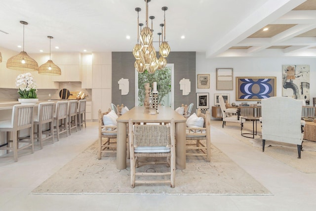 dining space with beamed ceiling and a chandelier