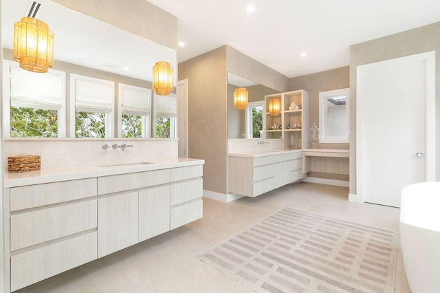 bathroom featuring vanity, tile patterned floors, and backsplash