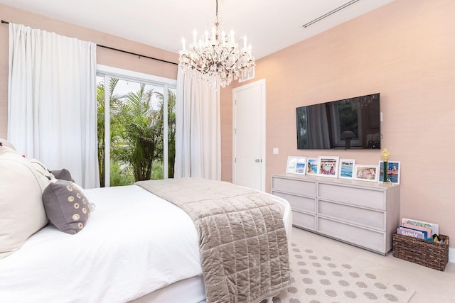 bedroom with a notable chandelier and access to exterior