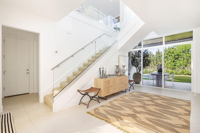 stairs featuring tile patterned floors