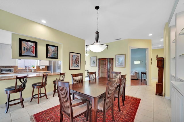 dining space with light tile patterned floors