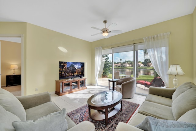 living room featuring ceiling fan and light tile patterned floors