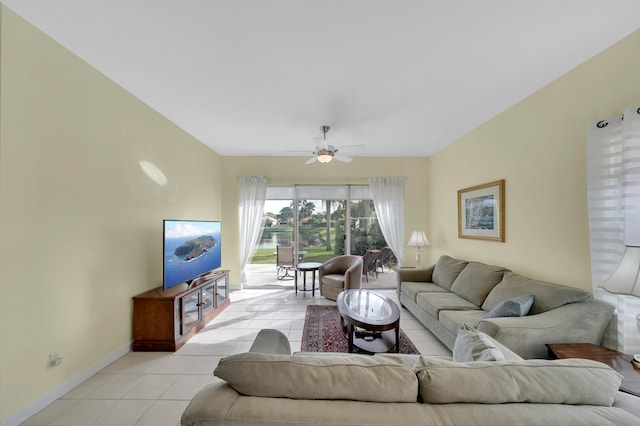 tiled living room with ceiling fan