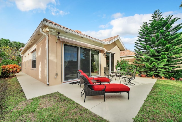 rear view of house with a patio