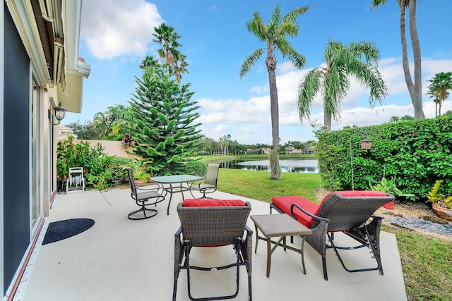 view of patio featuring a water view