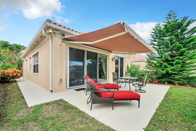 rear view of property with a patio area