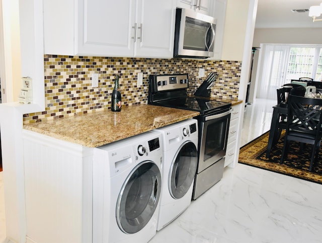 laundry area featuring separate washer and dryer