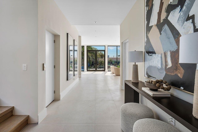 hallway with floor to ceiling windows and french doors