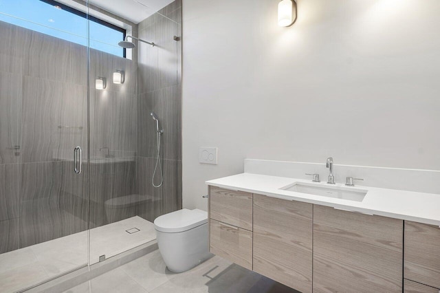 bathroom with tile patterned floors, vanity, toilet, and a shower with shower door