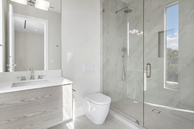 bathroom featuring vanity, toilet, and a shower with shower door