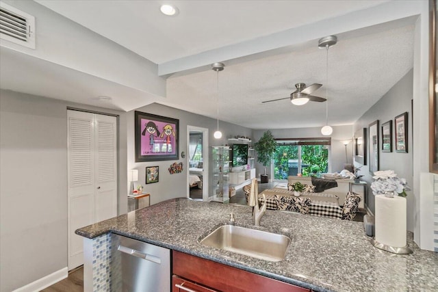 kitchen with pendant lighting, dark wood-type flooring, sink, stainless steel dishwasher, and ceiling fan