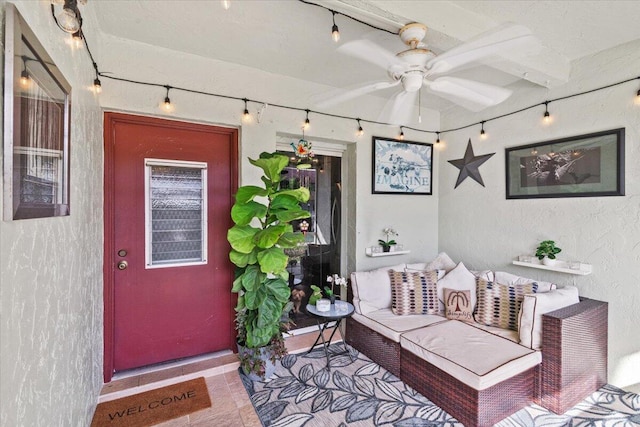 property entrance featuring ceiling fan