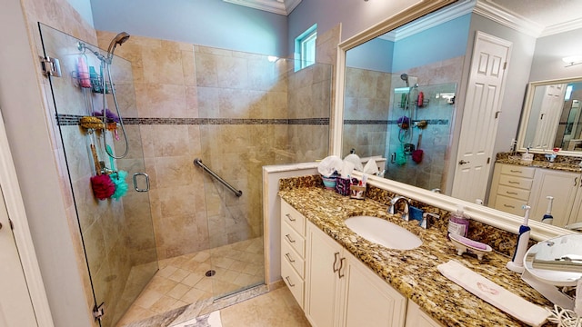 bathroom featuring walk in shower, ornamental molding, vanity, and tile patterned flooring