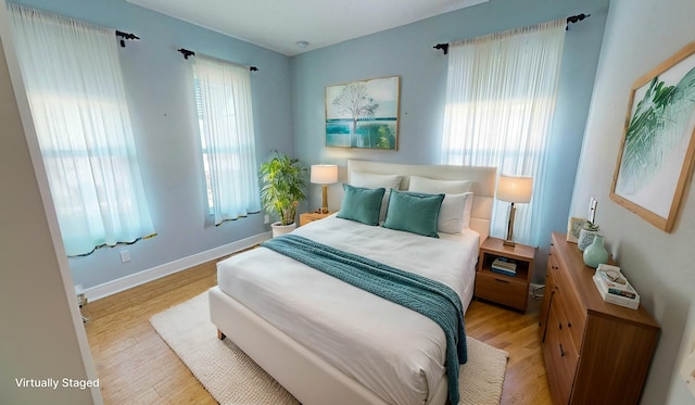 bedroom with light hardwood / wood-style flooring