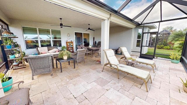 sunroom featuring ceiling fan