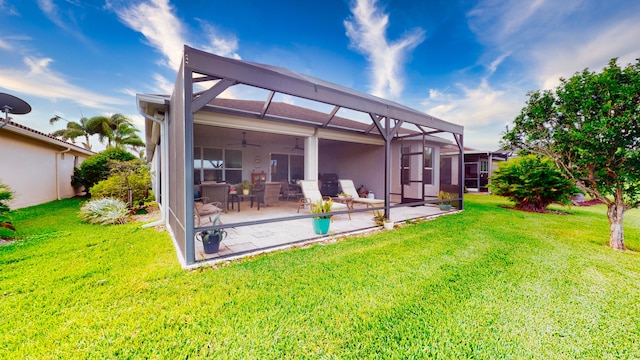 rear view of property featuring a patio, a lanai, a yard, and ceiling fan