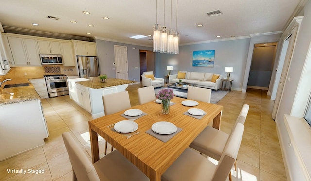 tiled dining space featuring crown molding, sink, and an inviting chandelier