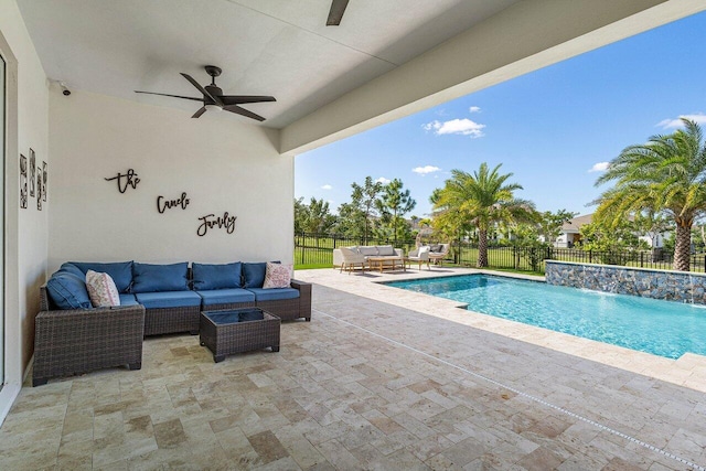 view of pool featuring a patio area, pool water feature, ceiling fan, and an outdoor hangout area