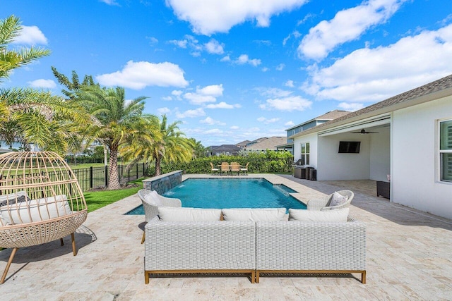 view of pool featuring ceiling fan and a patio area