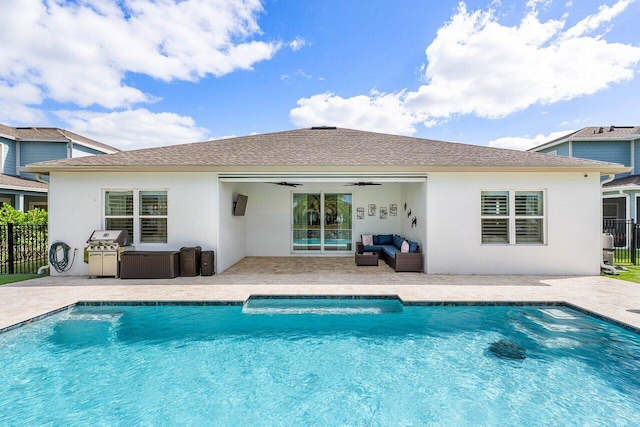 rear view of property featuring ceiling fan, a fenced in pool, an outdoor living space, and a patio