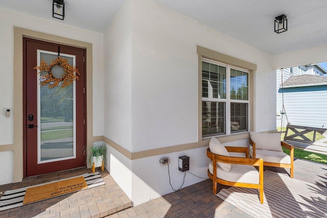 doorway to property with a porch