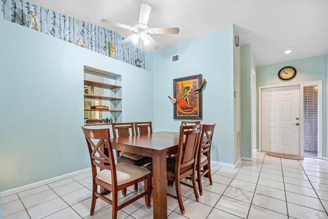 dining area with ceiling fan and light tile patterned flooring